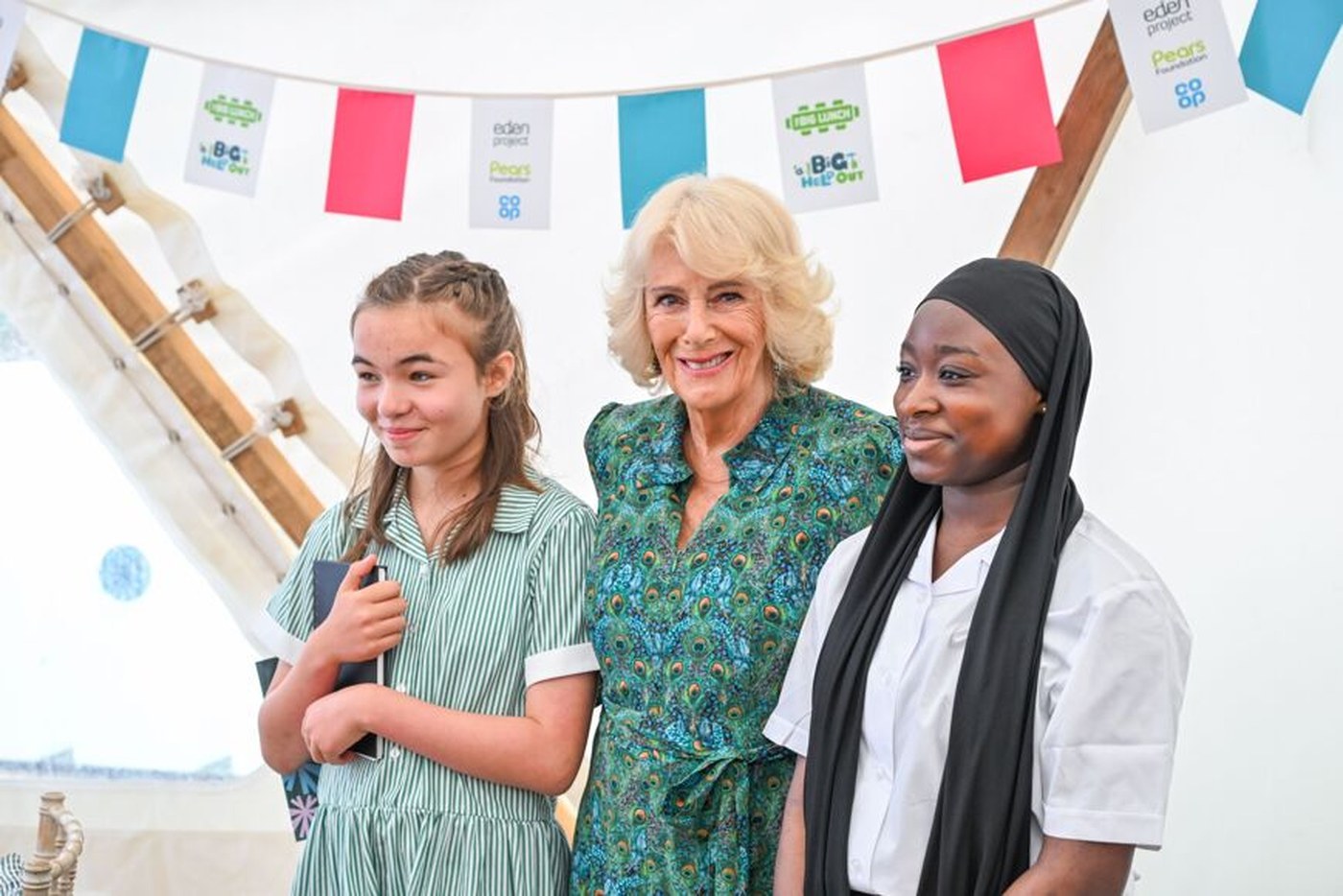 Queen Camilla with two newly appointed UK Young Poet Laureates
